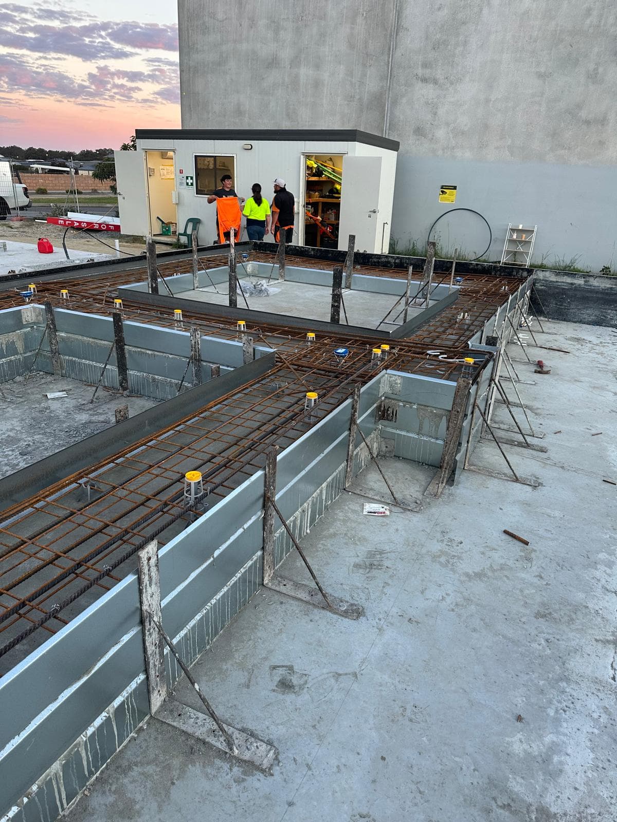 Concrete crew at work at dusk